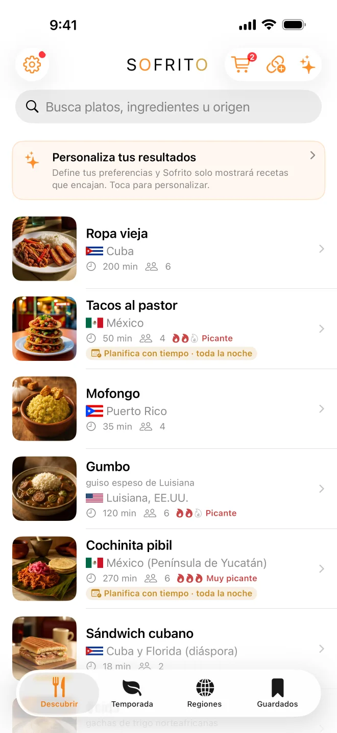 La pestaña Descubrir de Sofrito con ropa vieja cubana, tacos al pastor mexicanos y mofongo puertorriqueño, cada uno con su origen, tiempo y nivel de picante.